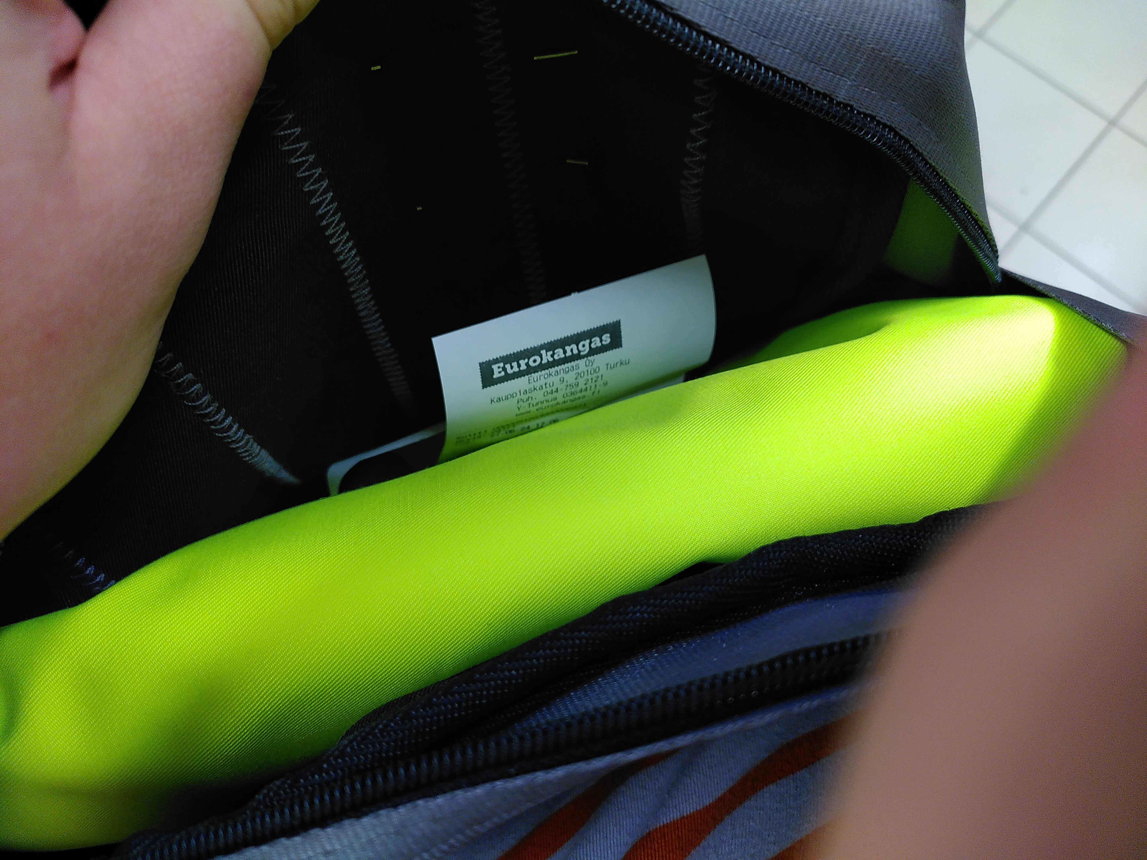 Photo of my bag, containing a folded up piece of neon high-visibility fabric